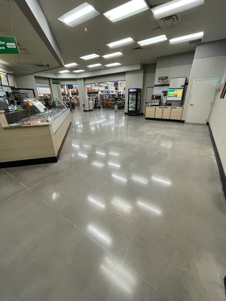 Retail deli and café area with polished concrete floors inside a commercial store
